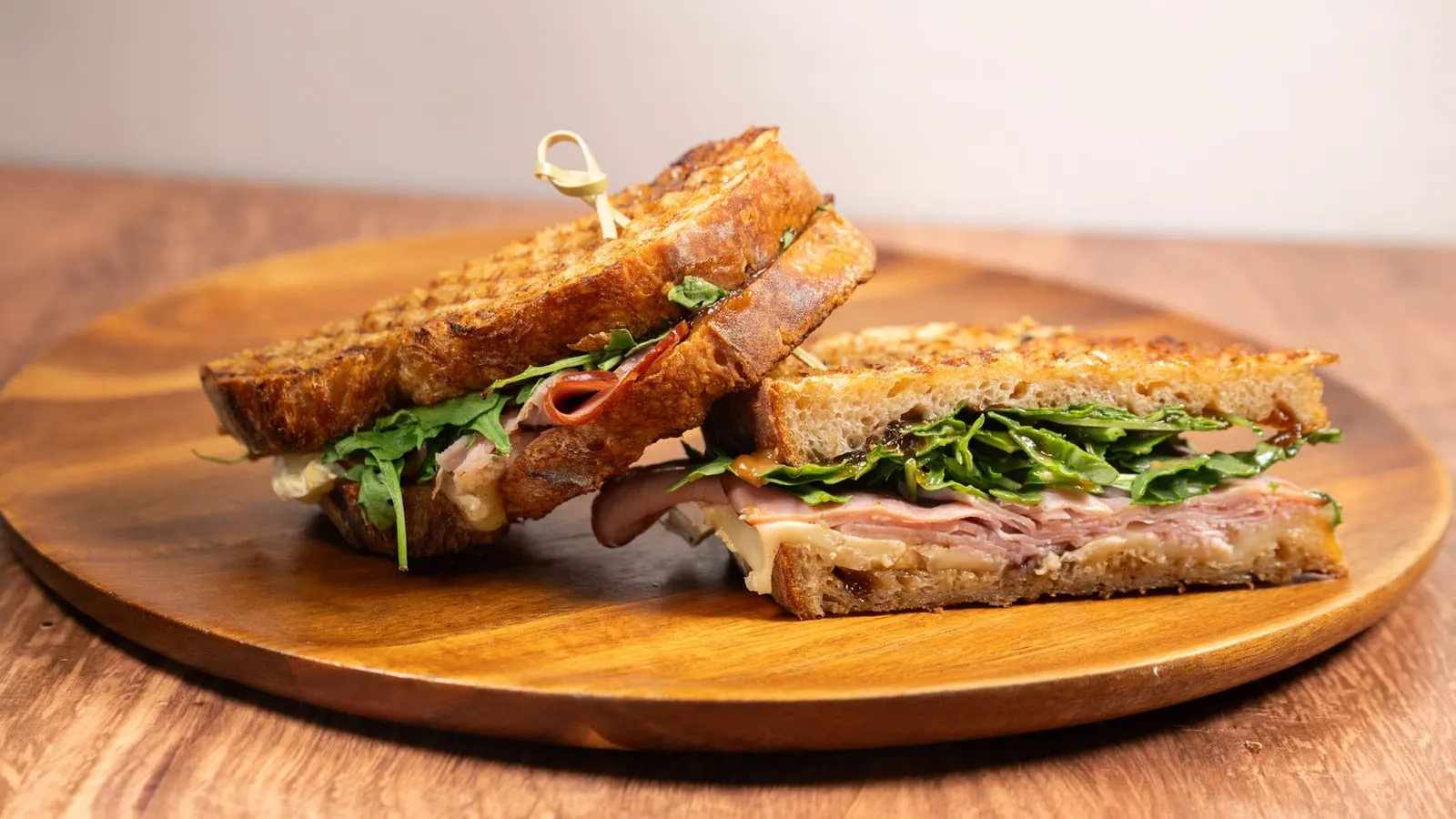 Pressed panini on a wood plate